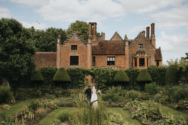 Chenies Manor House gardens, with bride & groom