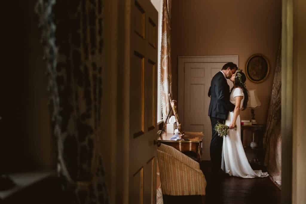 Chenies Manor House bride & groom kissing